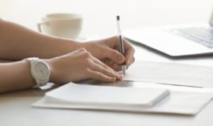 woman filling in paper work