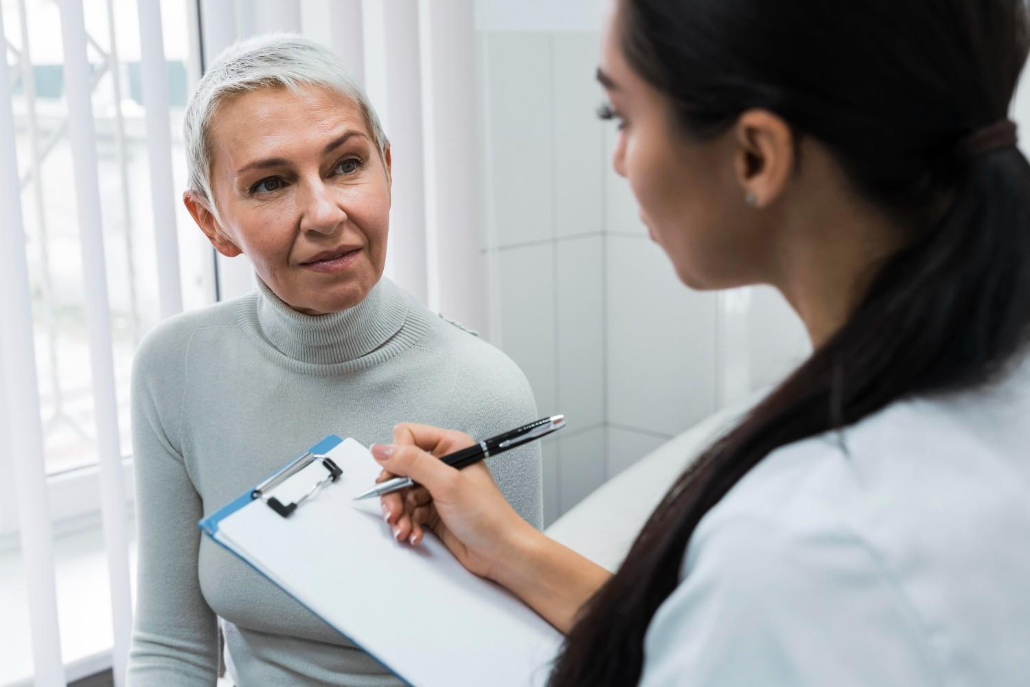 dentist taking notes about patient