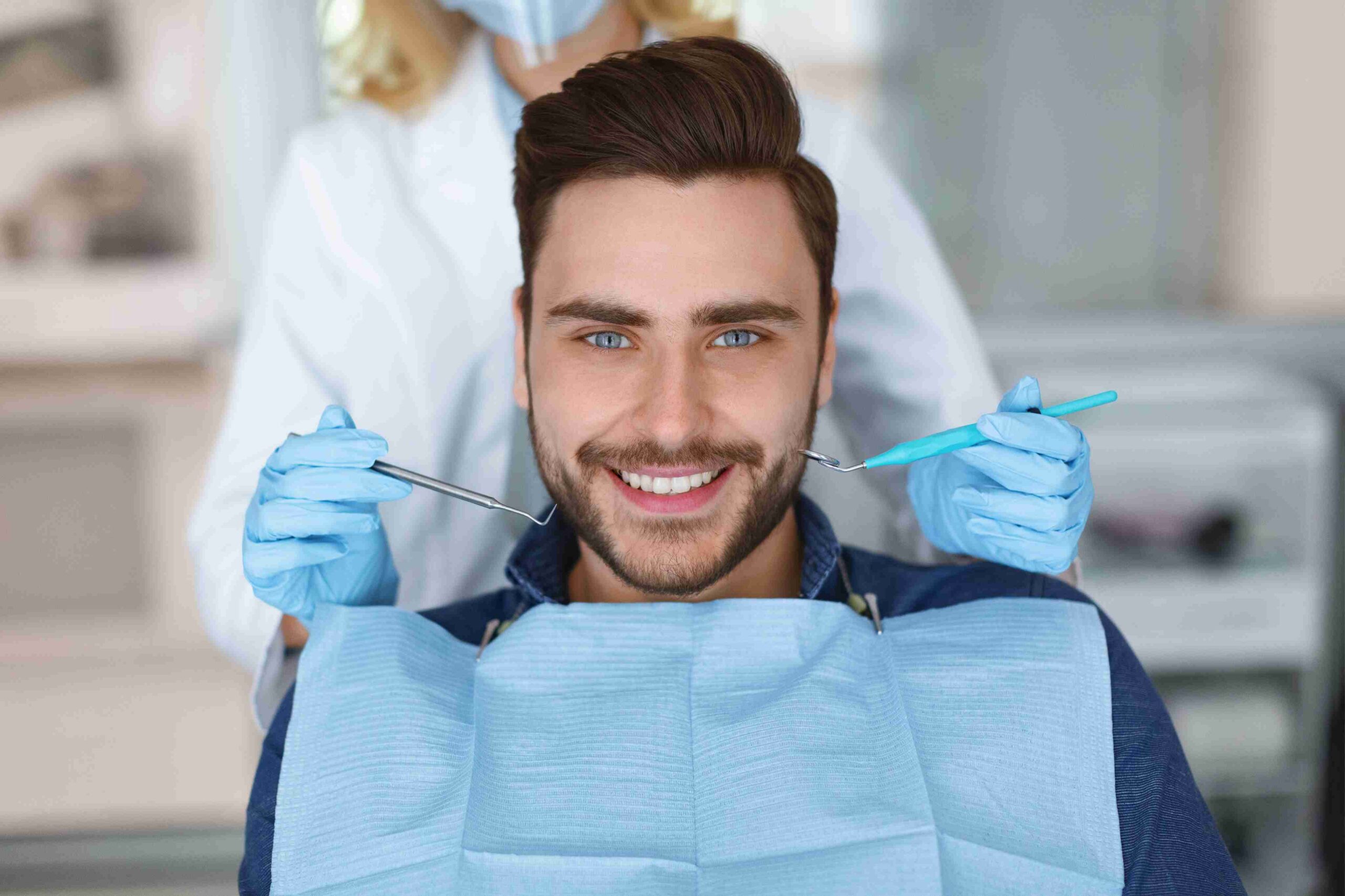 Smiling patient during an Invisalign consultation.